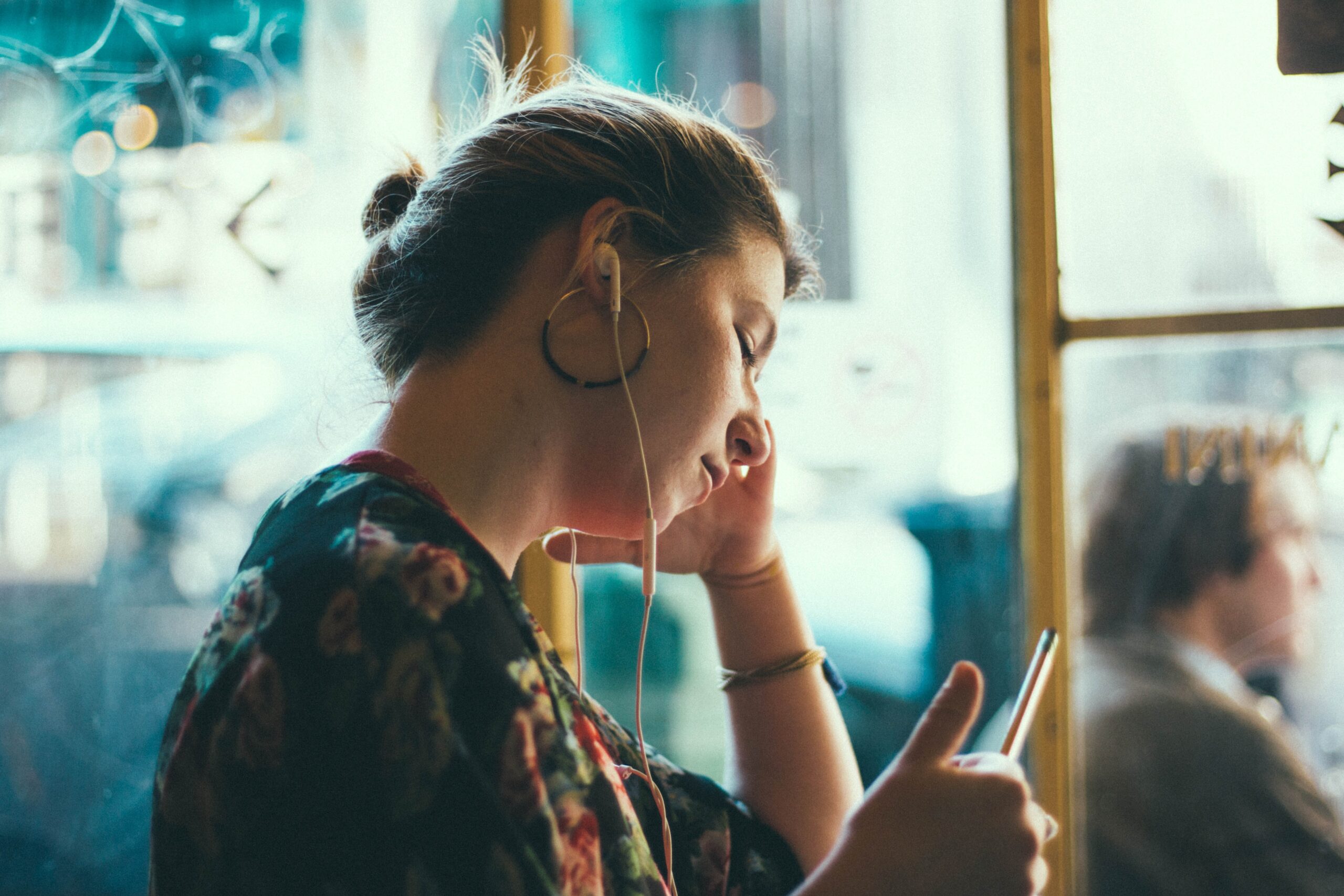 women listening to headphones
